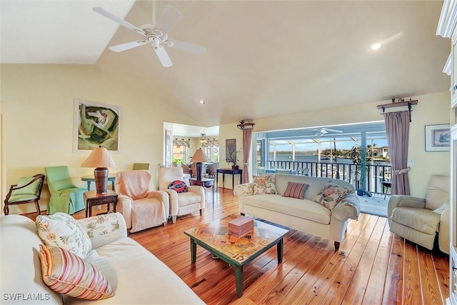 living room featuring light hardwood / wood-style flooring, ceiling fan, and lofted ceiling