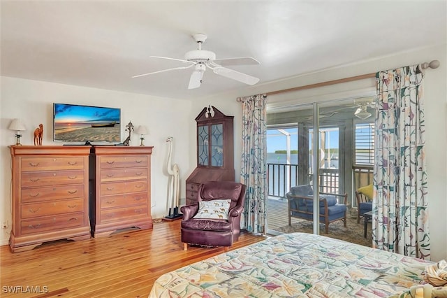 bedroom with access to exterior, ceiling fan, and wood-type flooring