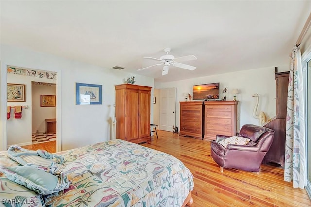 bedroom with ceiling fan and light hardwood / wood-style flooring