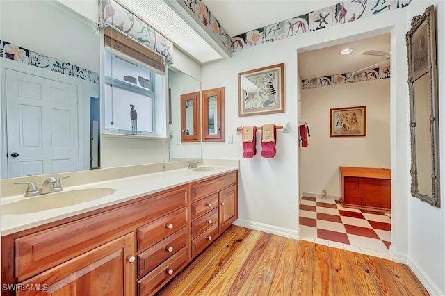 bathroom featuring hardwood / wood-style floors and vanity