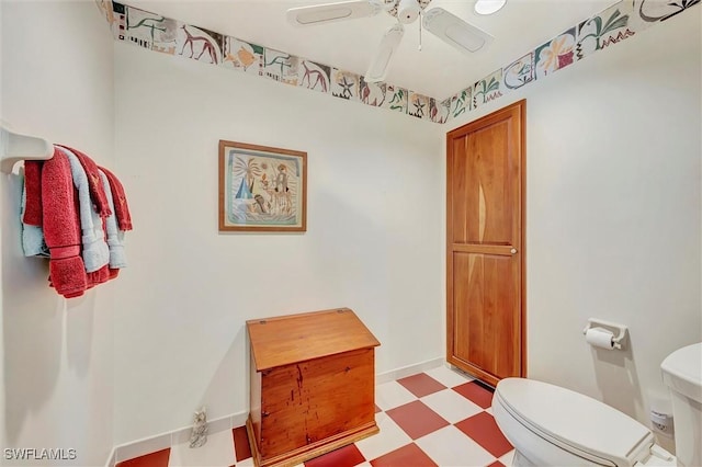 bathroom featuring ceiling fan and toilet