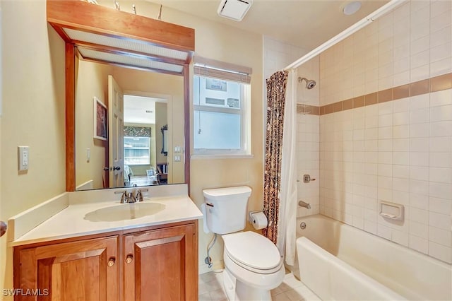 full bathroom featuring shower / bathtub combination with curtain, tile patterned flooring, vanity, and toilet