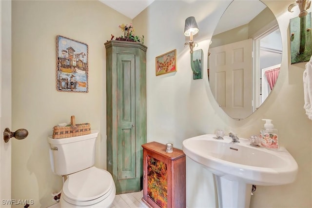 bathroom with sink and toilet