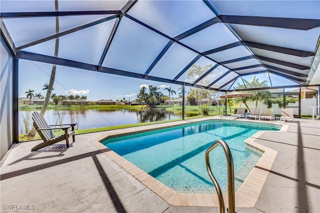 view of swimming pool with a water view, a patio area, and a lanai