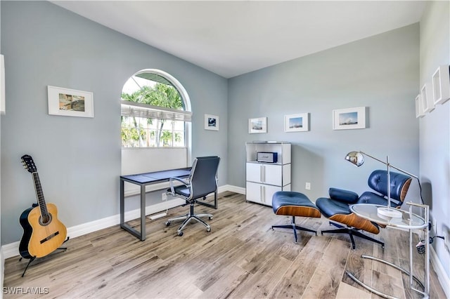 office area with light hardwood / wood-style flooring