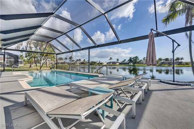 view of swimming pool featuring a lanai, a patio area, and a water view