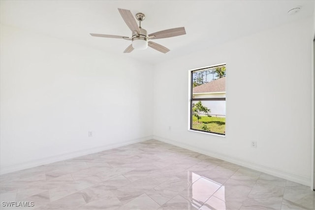 spare room with ceiling fan