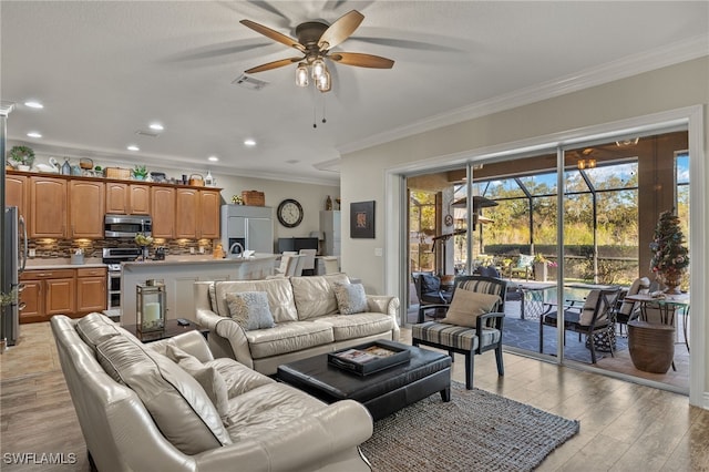 living room with ceiling fan, light hardwood / wood-style floors, and ornamental molding