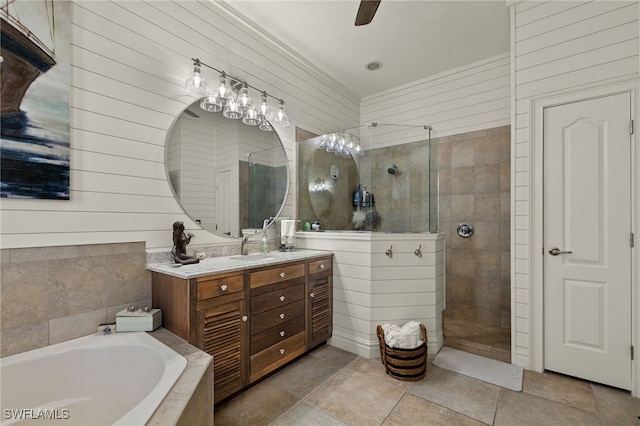 bathroom with vanity, wooden walls, ceiling fan, and independent shower and bath