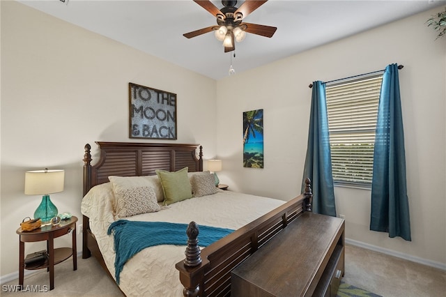 bedroom featuring ceiling fan and light colored carpet