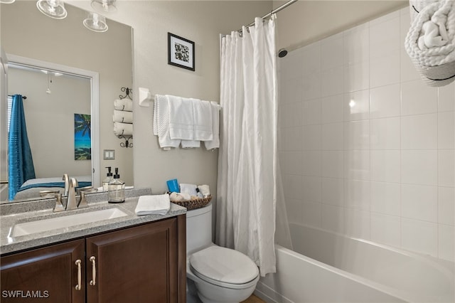 full bathroom with shower / bath combo, vanity, and toilet