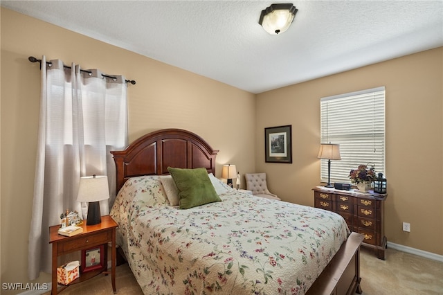 bedroom featuring light carpet