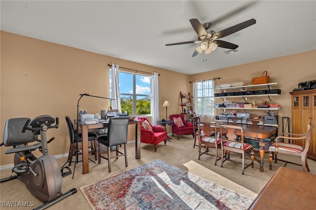 interior space featuring ceiling fan and light carpet