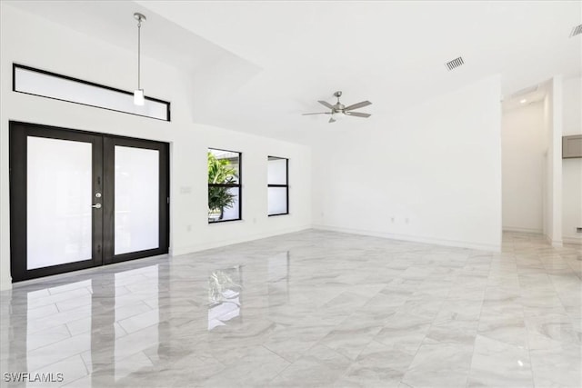 unfurnished room with french doors and ceiling fan