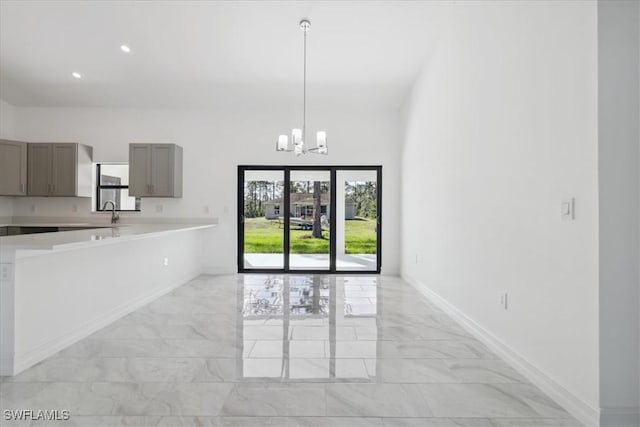 kitchen featuring a chandelier and hanging light fixtures