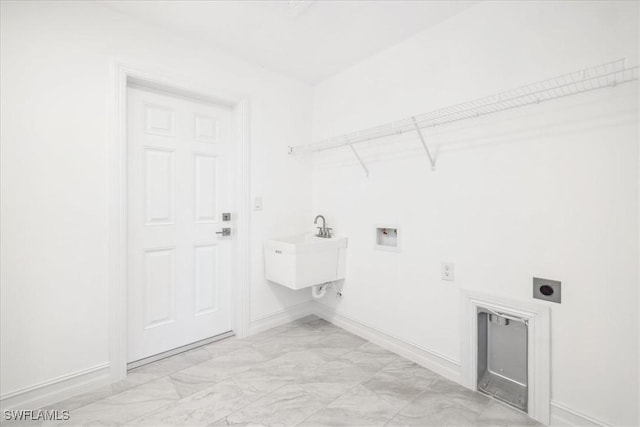 laundry room featuring hookup for an electric dryer, sink, and hookup for a washing machine