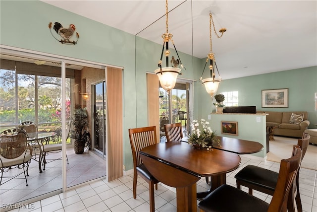 dining area featuring light tile patterned floors