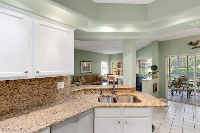 kitchen featuring sink, white cabinets, dishwasher, and light tile patterned floors