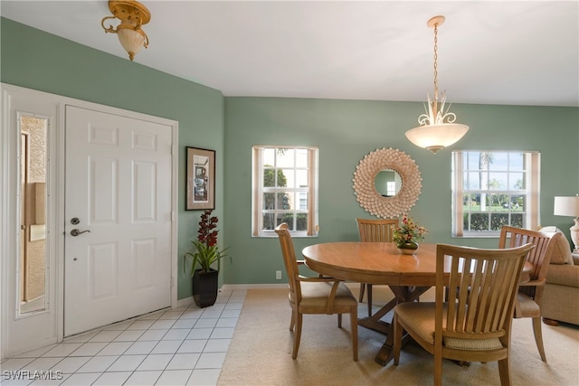 dining space featuring light tile patterned floors