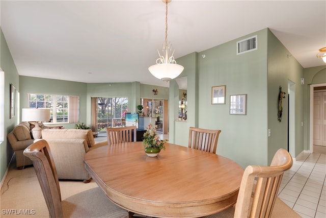 dining area with light tile patterned floors