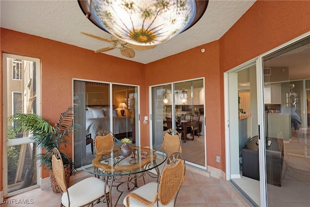 sunroom / solarium with ceiling fan