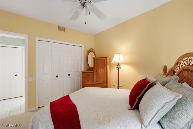 bedroom with light colored carpet, a closet, and ceiling fan