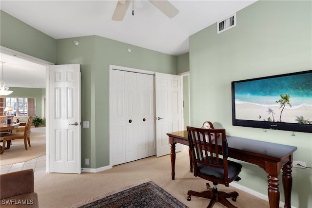 carpeted office featuring ceiling fan