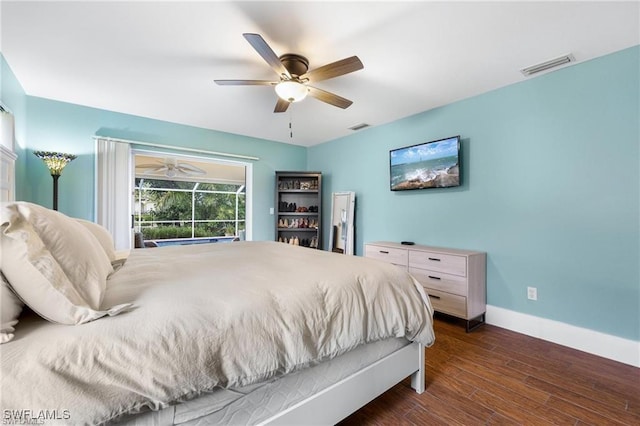 bedroom featuring ceiling fan and dark wood-type flooring