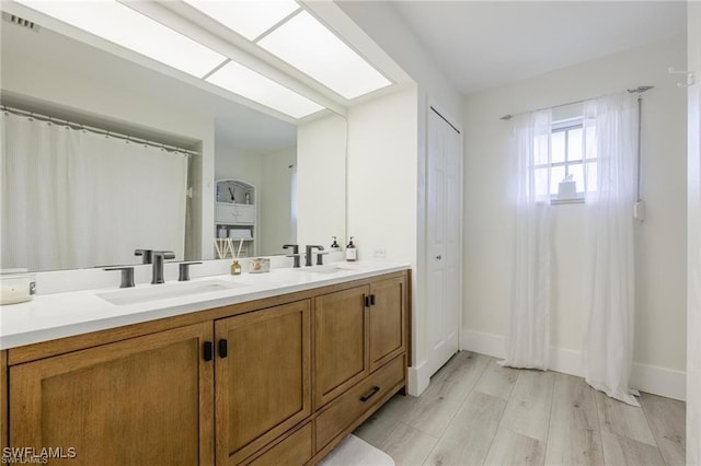 bathroom featuring vanity and wood-type flooring