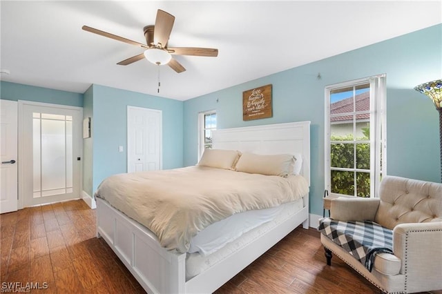 bedroom featuring a closet, ceiling fan, and dark hardwood / wood-style flooring