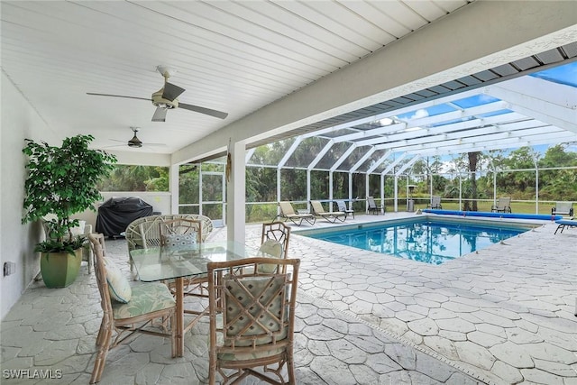 view of pool featuring a lanai, area for grilling, a patio area, and ceiling fan