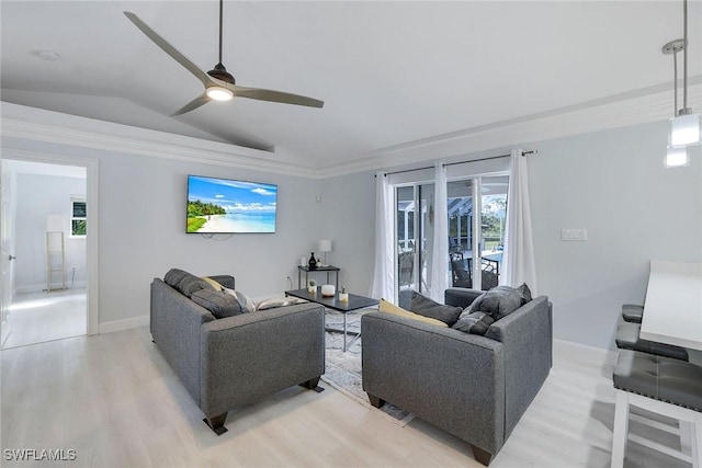 living room featuring light hardwood / wood-style floors, vaulted ceiling, and ceiling fan