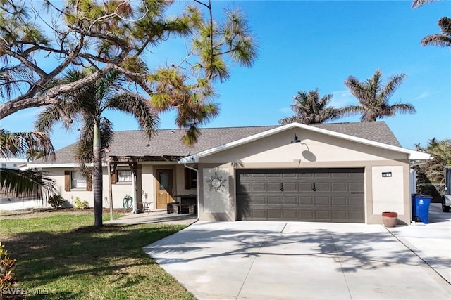 single story home featuring a garage and a front lawn