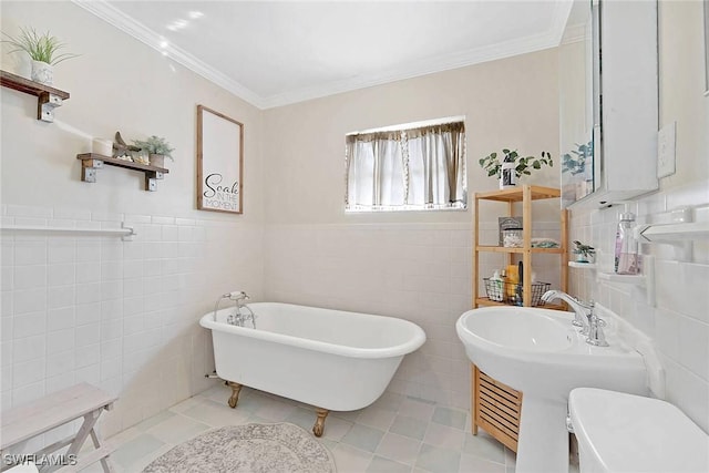 bathroom with tile patterned floors, a bathing tub, and tile walls