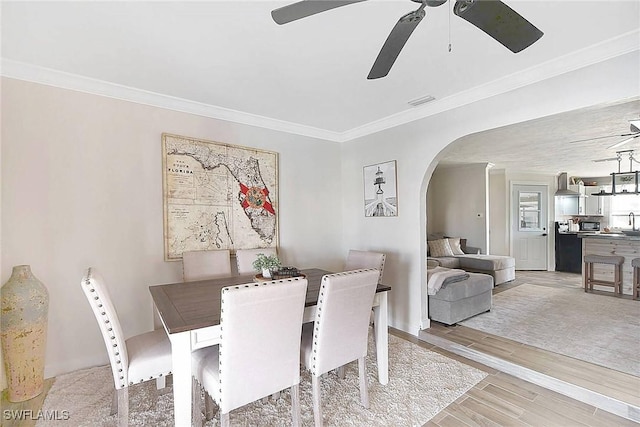 dining space featuring ornamental molding