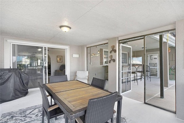 dining room with a textured ceiling