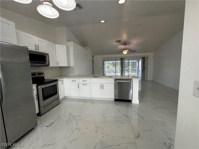 kitchen featuring white cabinets, ceiling fan, sink, and appliances with stainless steel finishes