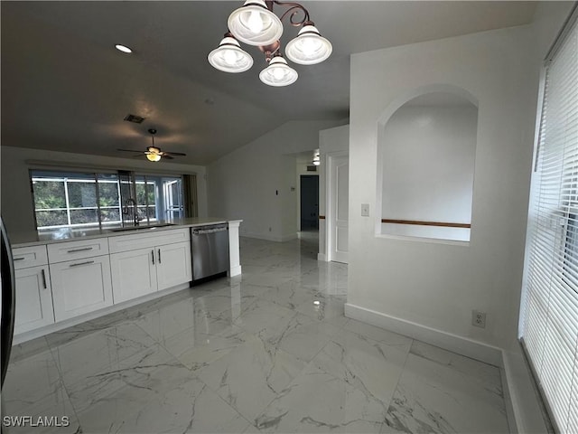 kitchen featuring ceiling fan, sink, stainless steel dishwasher, vaulted ceiling, and white cabinets