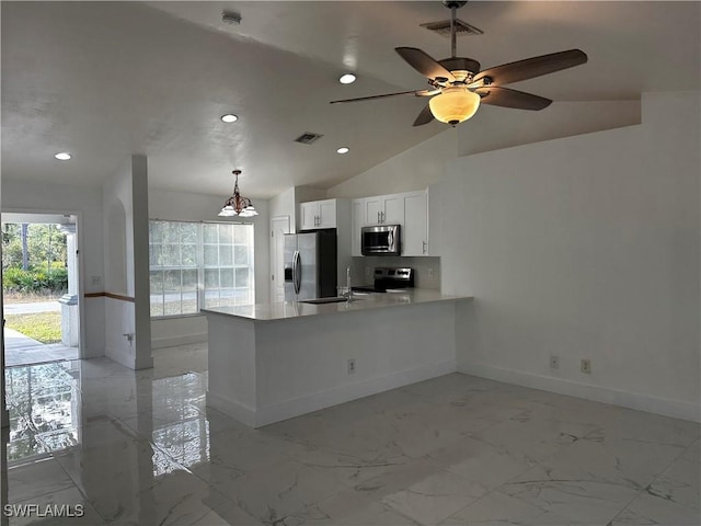 kitchen with lofted ceiling, hanging light fixtures, white cabinetry, kitchen peninsula, and stainless steel appliances