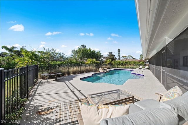 view of swimming pool featuring a patio area