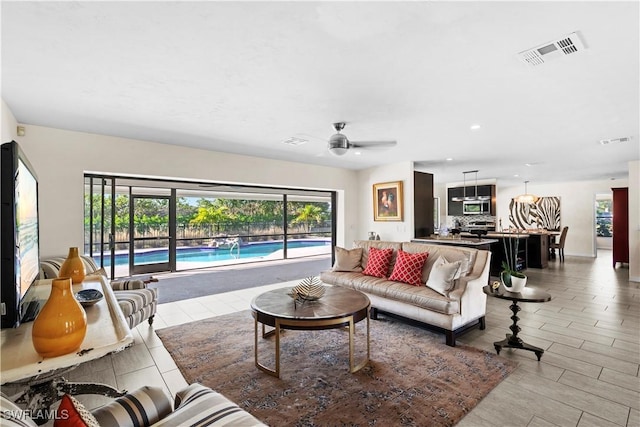 living room with ceiling fan