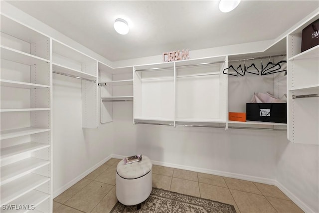 spacious closet featuring tile patterned floors