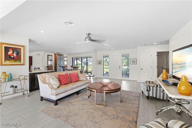 living room featuring ceiling fan