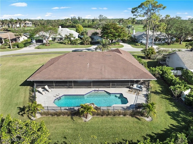 view of swimming pool with a yard and a patio