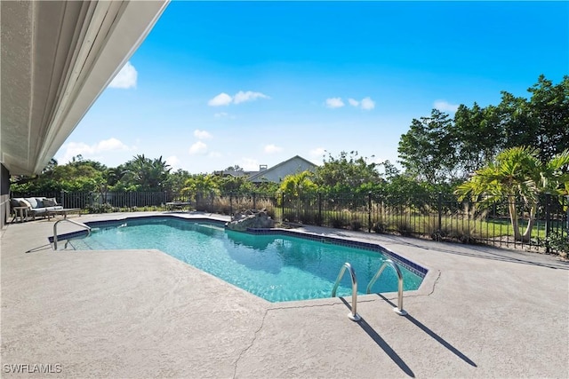 view of swimming pool featuring a patio