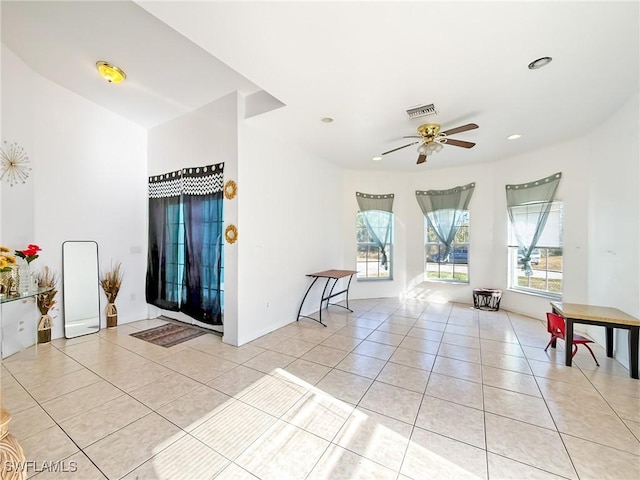 interior space featuring ceiling fan