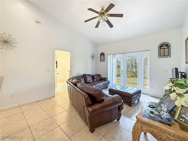 tiled living room featuring ceiling fan and lofted ceiling