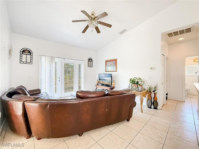 tiled living room featuring vaulted ceiling and ceiling fan