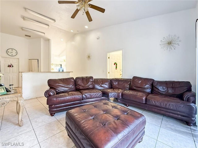 living room featuring ceiling fan and light tile patterned floors