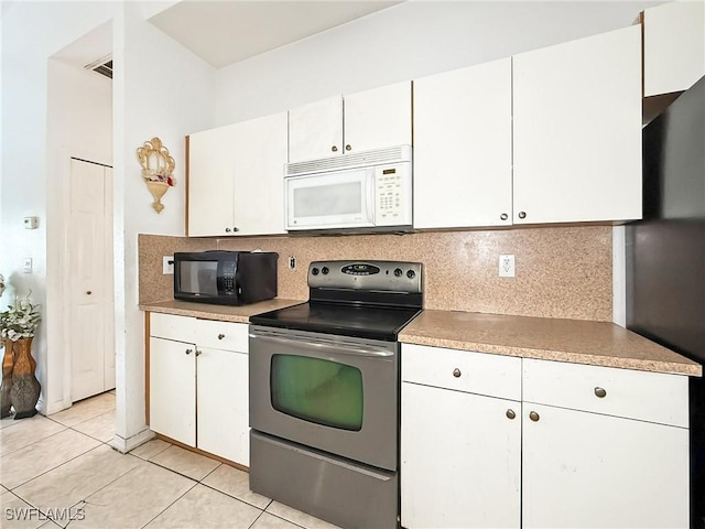 kitchen featuring tasteful backsplash, white cabinetry, and stainless steel electric range